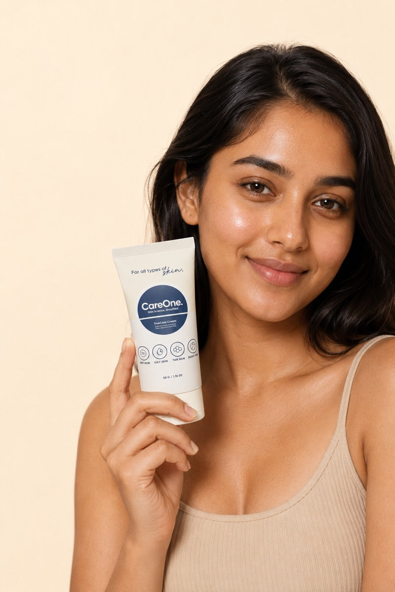 Young Indian woman with healthy glowing skin holding CareOne TrueCare Cream